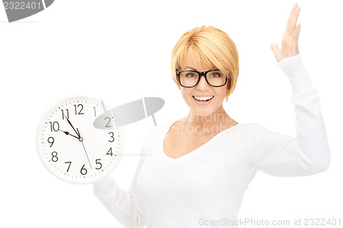 Image of woman holding big clock