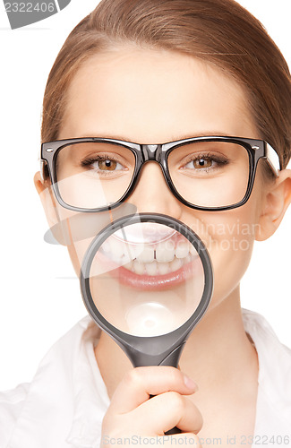 Image of woman with magnifying glass showing teeth