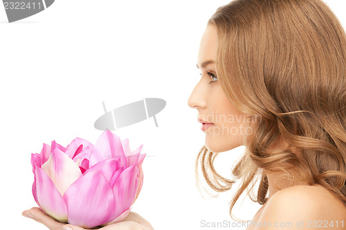 Image of beautiful woman with lotus flower
