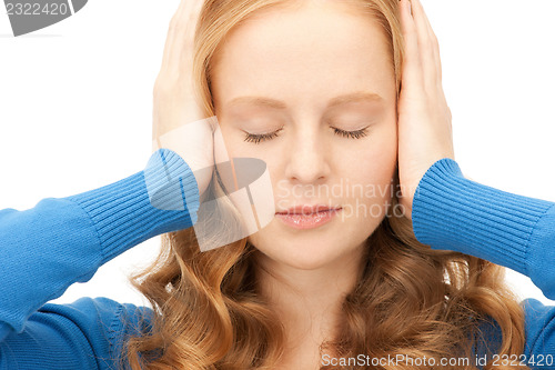 Image of woman with hands on ears