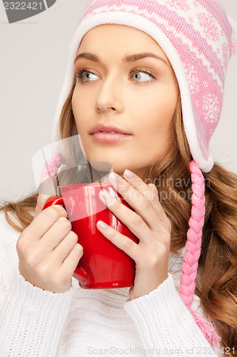 Image of beautiful woman with red mug