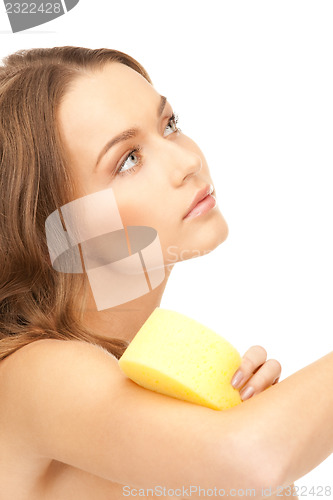 Image of beautiful woman with sponge