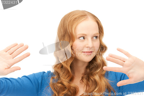 Image of businesswoman working with something imaginary