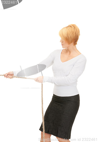 Image of business woman pulling rope