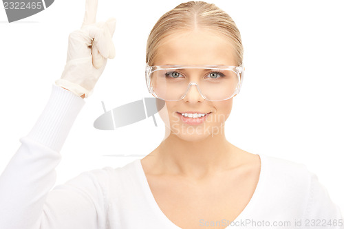 Image of woman in protective glasses and gloves