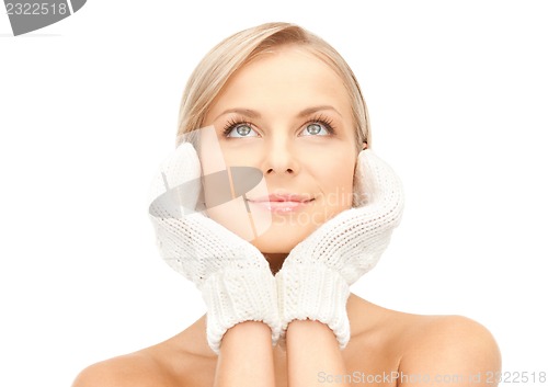 Image of beautiful woman in mittens
