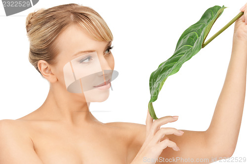 Image of woman with green leaf