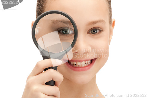 Image of teenage girl with magnifying glass