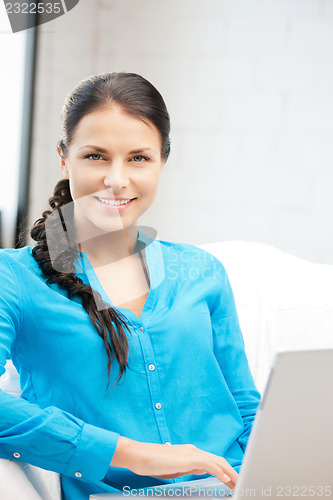 Image of happy woman with laptop computer