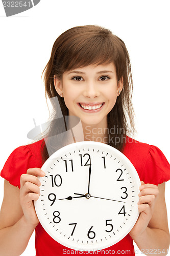 Image of teenage girl holding big clock