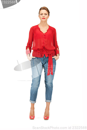 Image of lovely woman in red blouse and jeans