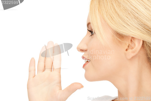 Image of woman whispering gossip