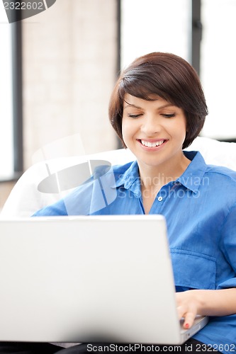 Image of happy woman with laptop computer