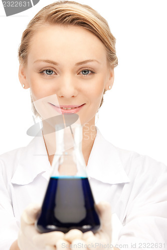 Image of lab worker holding up test tube