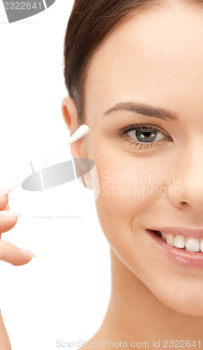 Image of beautiful woman with cotton bud