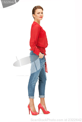 Image of lovely woman in red blouse and jeans