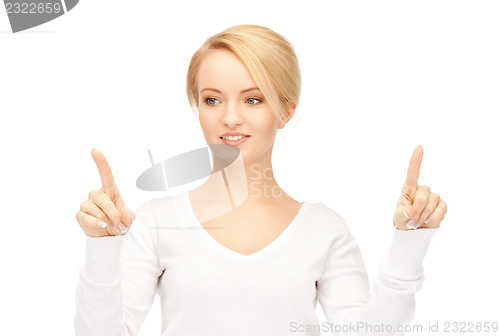 Image of businesswoman working with something imaginary