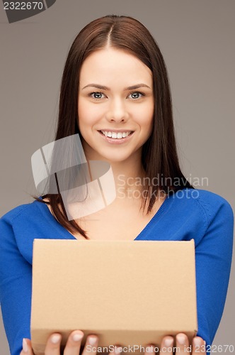 Image of attractive businesswoman with cardboard box
