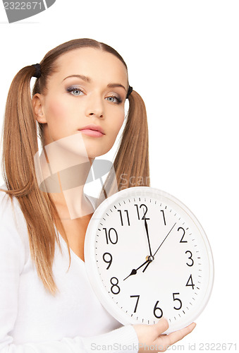 Image of woman holding big clock