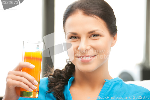 Image of beautiful woman with glass of juice