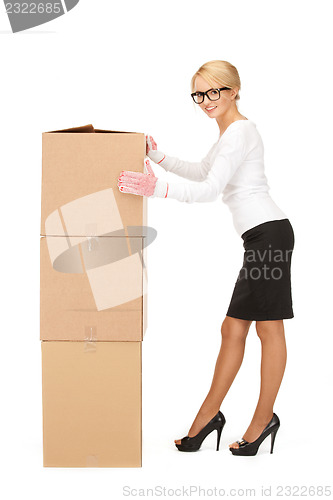 Image of attractive businesswoman with big boxes