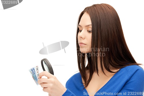 Image of woman with magnifying glass and euro cash money