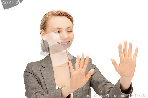 Image of businesswoman working with something imaginary