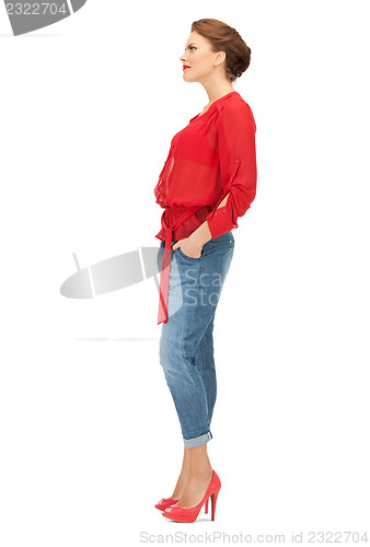 Image of lovely woman in red blouse and jeans