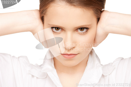 Image of woman with hands on ears