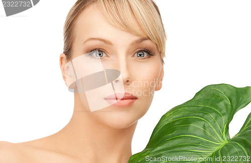 Image of woman with green leaf