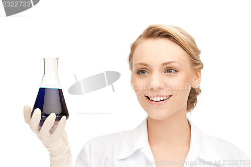 Image of lab worker holding up test tube