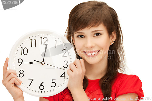 Image of teenage girl holding big clock