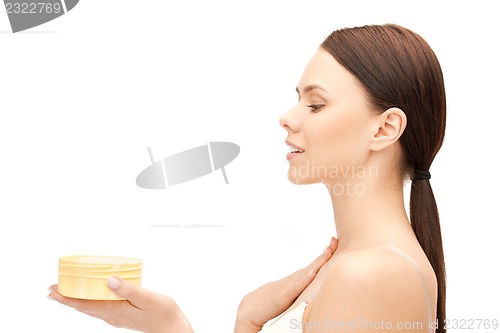 Image of beautiful woman with moisturizing creme