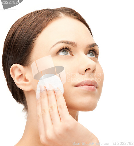 Image of beautiful woman with cotton pad