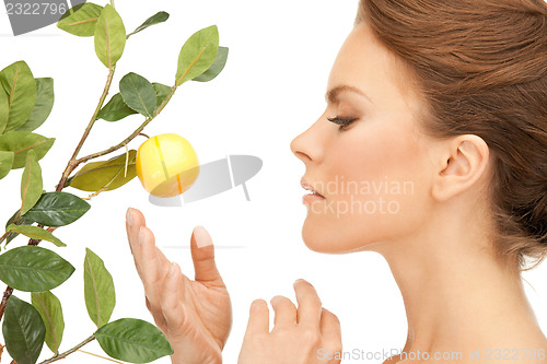 Image of lovely woman with lemon twig