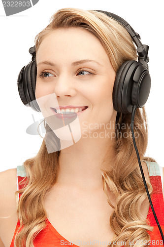 Image of happy teenage girl in big headphones