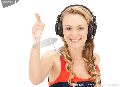 Image of happy teenage girl in big headphones