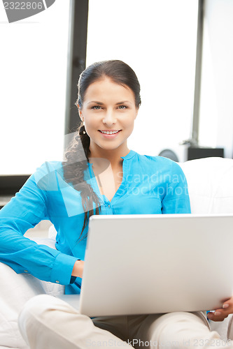 Image of happy woman with laptop computer