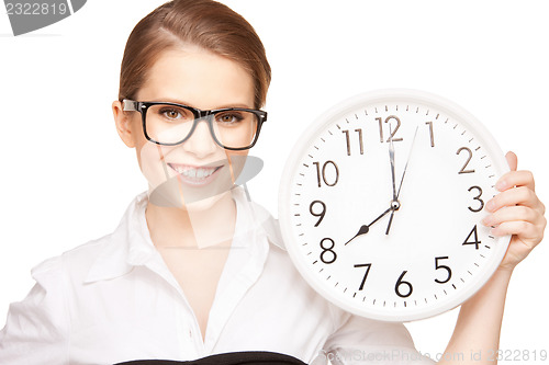 Image of woman holding big clock