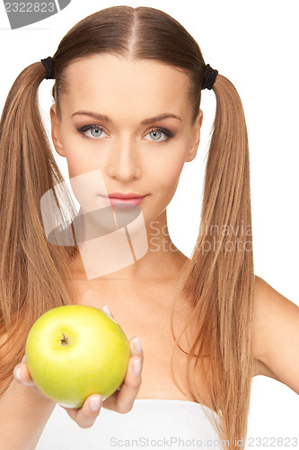 Image of young beautiful woman with green apple