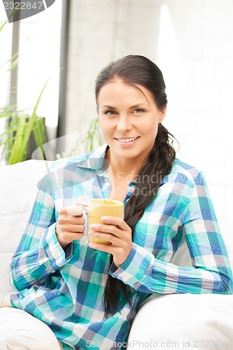 Image of lovely housewife with mug