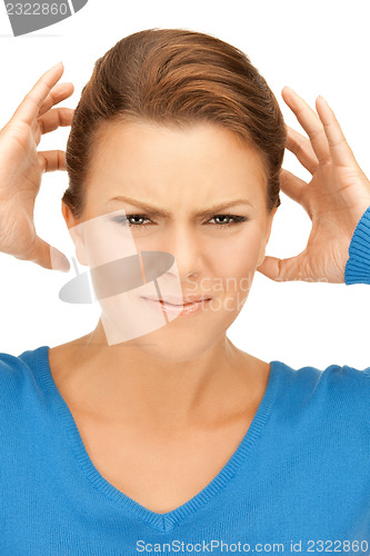 Image of woman with hands on ears