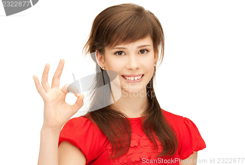 Image of lovely teenage girl showing ok sign