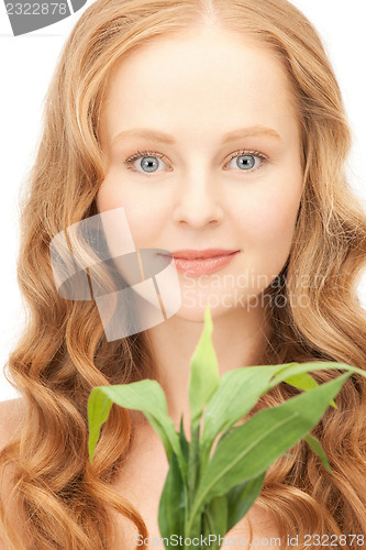 Image of woman with green sprout