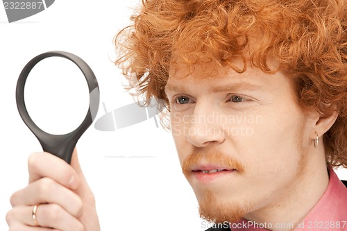 Image of man with magnifying glass