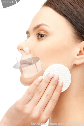 Image of beautiful woman with cotton pad