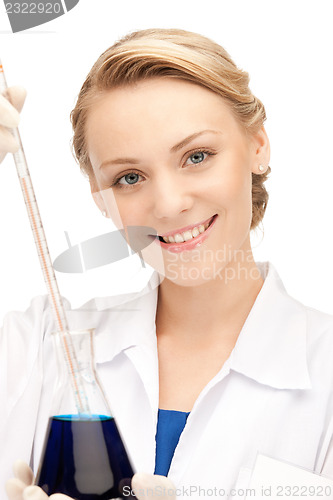 Image of lab worker holding up test tube