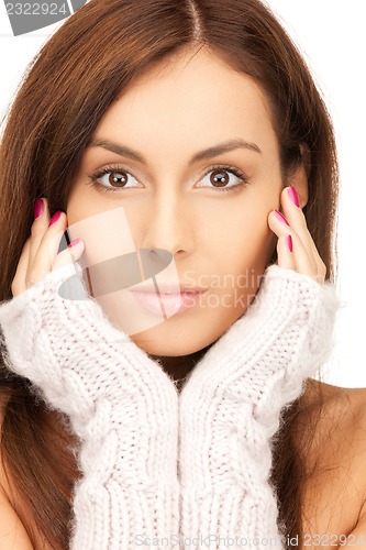 Image of beautiful woman in mittens