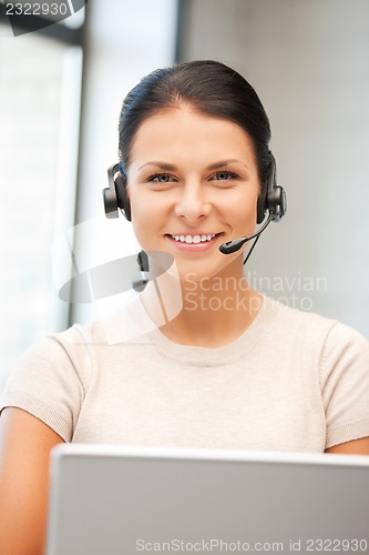 Image of helpline operator with laptop computer