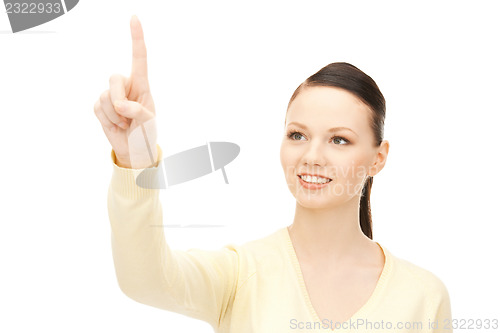 Image of businesswoman working with something imaginary